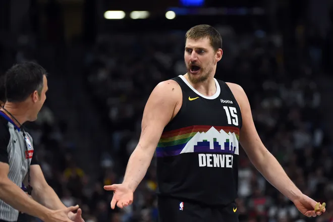 Mar 17, 2026; Denver, Colorado, USA; Denver Nuggets center Nikola Jokic (15) questions an official after a foul during the first half against the Philadelphia 76ers at Ball Arena. Mandatory Credit: Christopher Hanewinckel-Imagn Images