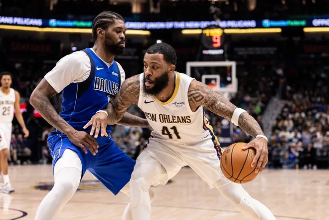 Mar 16, 2026; New Orleans, Louisiana, USA; New Orleans Pelicans guard/forward Saddiq Bey (41) dribbles against Dallas Mavericks forward Naji Marshall (13) during the second half at Smoothie King Center.