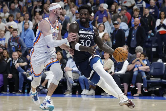 Mar 15, 2026; Oklahoma City, Oklahoma, USA; Minnesota Timberwolves forward/center Julius Randle (30) drives around Oklahoma City Thunder guard Alex Caruso (9) during the second half at Paycom Center.