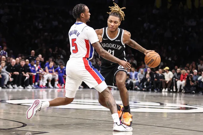Mar 10, 2026; Brooklyn, New York, USA; Brooklyn Nets forward Noah Clowney (21) looks to drive past Detroit Pistons forward Ronald Holland II (5) in the second quarter at Barclays Center. Mandatory Credit: Wendell Cruz-Imagn Images