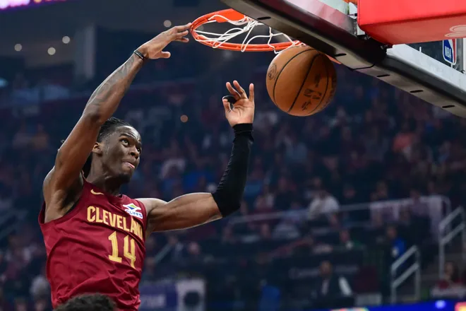 Mar 15, 2026; Cleveland, Ohio, USA; Cleveland Cavaliers guard Keon Ellis (14) dunks against the Dallas Mavericks during the second half at Rocket Arena. Mandatory Credit: Ken Blaze-Imagn Images