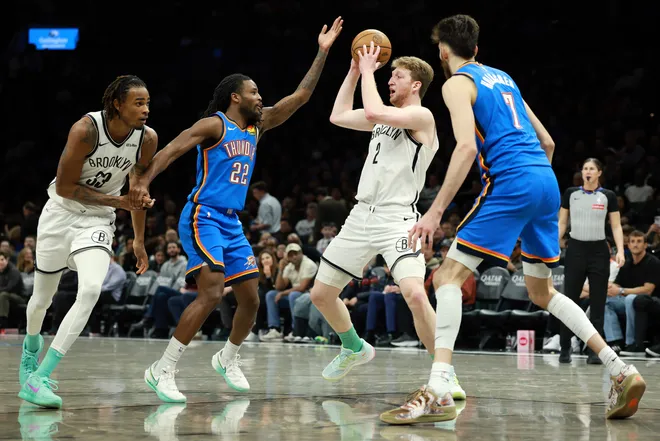 NEW YORK, NEW YORK - MARCH 18: Danny Wolf #2 of the Brooklyn Nets looks to pass as Cason Wallace #22 of the Oklahoma City Thunder defends during the second half at Barclays Center on March 18, 2026 in the Brooklyn borough of New York City. The Thunder won 121-92. NOTE TO USER: User expressly acknowledges and agrees that, by downloading and or using this photograph, User is consenting to the terms and conditions of the Getty Images License Agreement. (Photo by Sarah Stier/Getty Images)