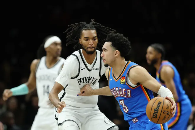 NEW YORK, NEW YORK - MARCH 18: Jared McCain #3 of the Oklahoma City Thunder dribbles against Ziaire Williams #1 of the Brooklyn Nets during the second half at Barclays Center on March 18, 2026 in the Brooklyn borough of New York City. The Thunder won 121-92. NOTE TO USER: User expressly acknowledges and agrees that, by downloading and or using this photograph, User is consenting to the terms and conditions of the Getty Images License Agreement. (Photo by Sarah Stier/Getty Images)