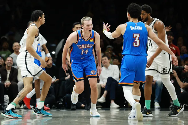 NEW YORK, NEW YORK - MARCH 18: Payton Sandfort #14 reacts with Jared McCain #3 of the Oklahoma City Thunder after scoring in his NBA debut during the second half against the Brooklyn Nets at Barclays Center on March 18, 2026 in the Brooklyn borough of New York City. The Thunder won 121-92. NOTE TO USER: User expressly acknowledges and agrees that, by downloading and or using this photograph, User is consenting to the terms and conditions of the Getty Images License Agreement. (Photo by Sarah Stier/Getty Images)
