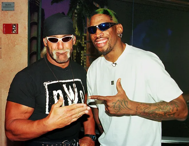 Dennis Rodman (R) of the Chicago Bulls poses with World Champion Professional wrestler Hollywood Hulk Hogan (L) following a press conference.