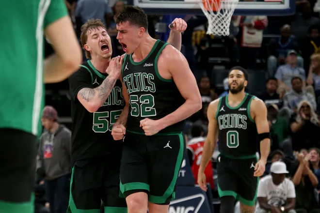 Mar 20, 2026; Memphis, Tennessee, USA; Boston Celtics guard Baylor Scheierman (55) and center Luka Garza (52) react during the fourth quarter against the Memphis Grizzlies at FedExForum. Mandatory Credit: Petre Thomas-Imagn Images