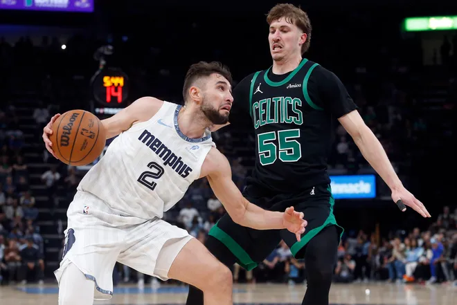 Mar 20, 2026; Memphis, Tennessee, USA; Memphis Grizzlies guard Ty Jerome (2) drives to the basket as Boston Celtics guard Baylor Scheierman (55) defends during the fourth quarter at FedExForum. Mandatory Credit: Petre Thomas-Imagn Images