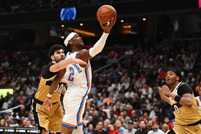 Mar 21, 2026; Washington, District of Columbia, USA; Oklahoma City Thunder guard Shai Gilgeous-Alexander (2) is fouled by Washington Wizards forward Tristan Vukcevic (00) during the second half at Capital One Arena. Mandatory Credit: Brad Mills-Imagn Images