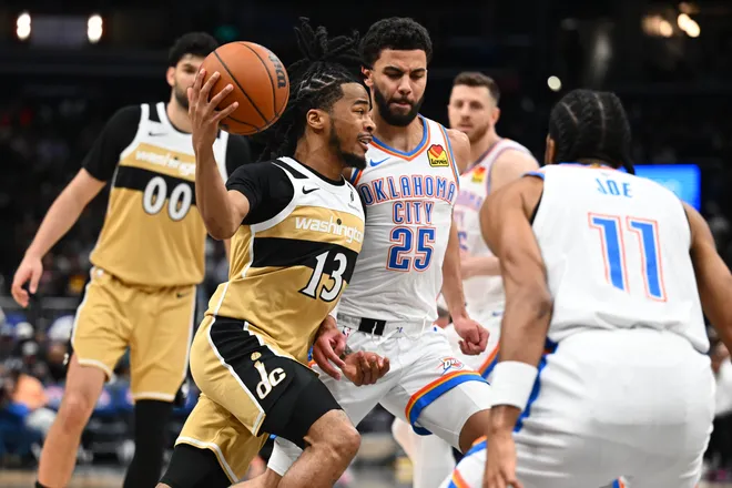 Mar 21, 2026; Washington, District of Columbia, USA; Washington Wizards guard Sharife Cooper (13) dribbles as Oklahoma City Thunder guard Ajay Mitchell (25) defends during the first half at Capital One Arena. Mandatory Credit: Brad Mills-Imagn Images