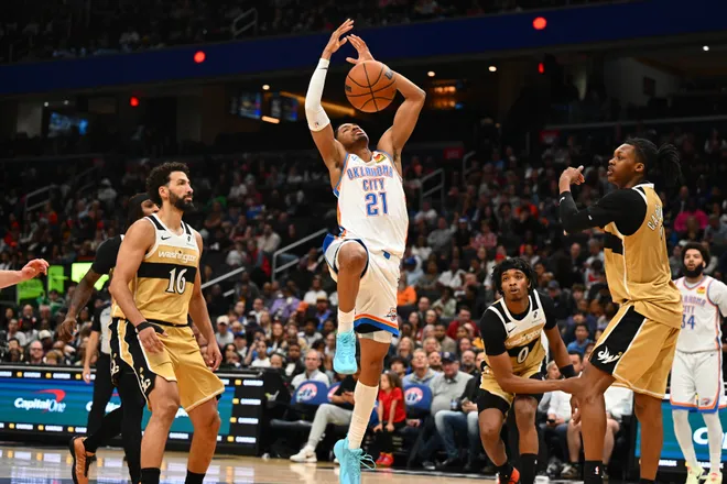 Mar 21, 2026; Washington, District of Columbia, USA; Oklahoma City Thunder guard Aaron Wiggins (21) loses control of the ball as Washington Wizards forward Anthony Gill (16) looks on during the second half at Capital One Arena. Mandatory Credit: Brad Mills-Imagn Images