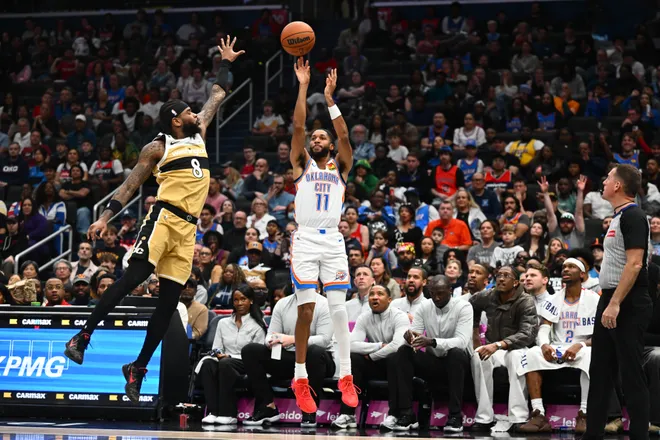 Mar 21, 2026; Washington, District of Columbia, USA; Oklahoma City Thunder guard Isaiah Joe (11) shoots over Washington Wizards guard Jaden Hardy (8) during the second half at Capital One Arena. Mandatory Credit: Brad Mills-Imagn Images