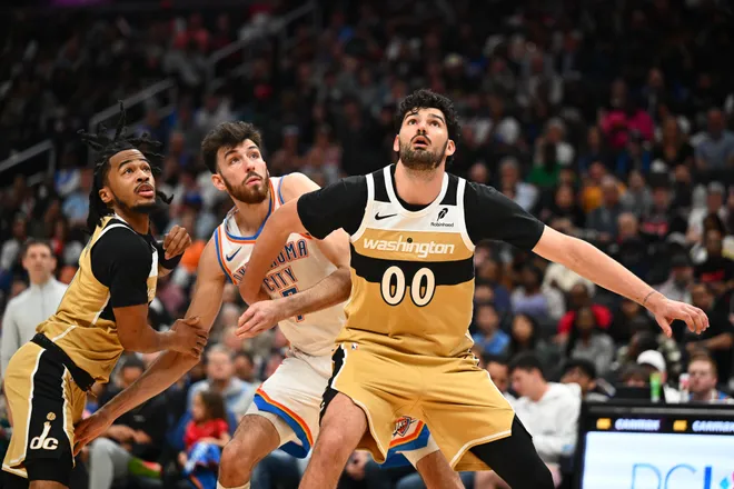 Mar 21, 2026; Washington, District of Columbia, USA; Washington Wizards forward Tristan Vukcevic (00) boxes out Oklahoma City Thunder center/forward Chet Holmgren (7) and Washington Wizards guard Sharife Cooper (13) during the second half at Capital One Arena. Mandatory Credit: Brad Mills-Imagn Images