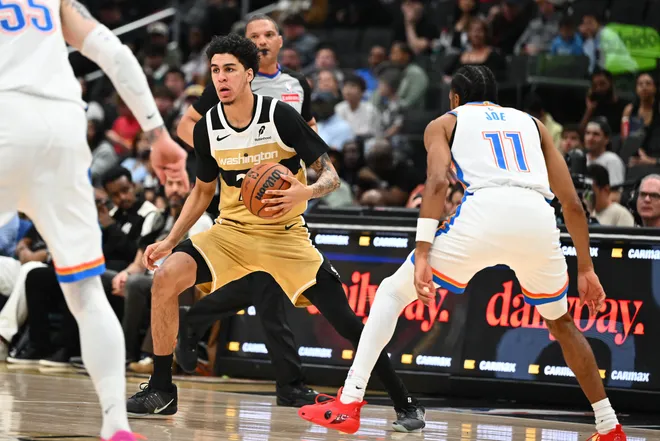 Mar 21, 2026; Washington, District of Columbia, USA; Washington Wizards forward Will Riley (27) dribbles as Oklahoma City Thunder guard Isaiah Joe (11) defends during the first half at Capital One Arena. Mandatory Credit: Brad Mills-Imagn Images