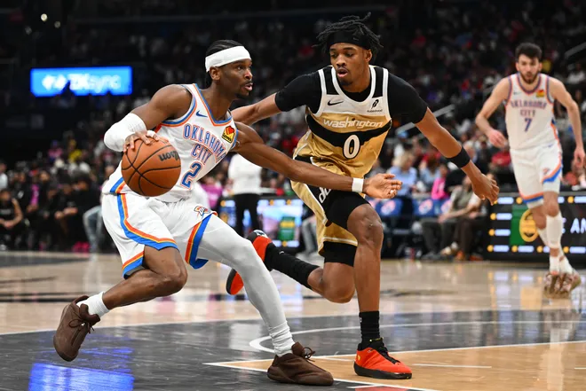Mar 21, 2026; Washington, District of Columbia, USA; Oklahoma City Thunder guard Shai Gilgeous-Alexander (2) drives as Washington Wizards guard Bilal Coulibaly (0) defends during the second half at Capital One Arena. Mandatory Credit: Brad Mills-Imagn Images