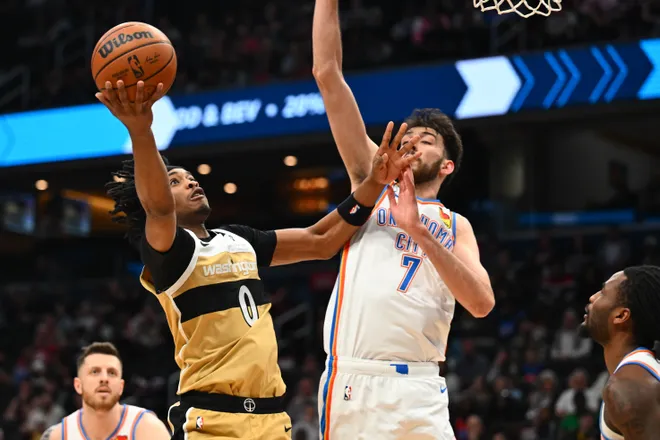 Mar 21, 2026; Washington, District of Columbia, USA; Washington Wizards guard Bilal Coulibaly (0) shoots over Oklahoma City Thunder center/forward Chet Holmgren (7) during the first half at Capital One Arena. Mandatory Credit: Brad Mills-Imagn Images