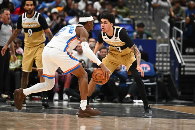 Mar 21, 2026; Washington, District of Columbia, USA; Washington Wizards forward Will Riley (27) defends Oklahoma City Thunder guard Shai Gilgeous-Alexander (2) during the first half at Capital One Arena. Mandatory Credit: Brad Mills-Imagn Images