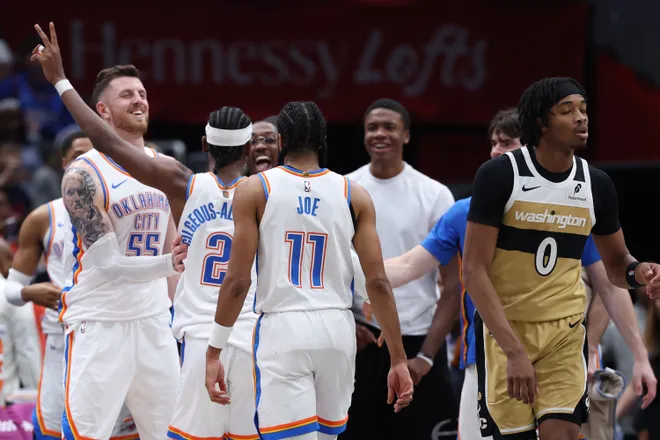 WASHINGTON, DC - MARCH 21: Shai Gilgeous-Alexander #2 of the Oklahoma City Thunder celebrates with teammates after scoring his 40th point of the game against the Washington Wizards during the second half at Capital One Arena on March 21, 2026 in Washington, DC. NOTE TO USER: User expressly acknowledges and agrees that, by downloading and or using this photograph, User is consenting to the terms and conditions of the Getty Images License Agreement. (Photo by Patrick Smith/Getty Images)