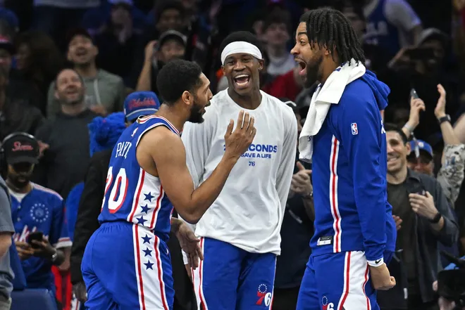 Mar 10, 2026; Philadelphia, Pennsylvania, USA; Philadelphia 76ers guard Cameron Payne (20) celebrates a three point basket with guard Vj Edgecombe (77) and forward Trendon Watford (12) against the Memphis Grizzlies during the second half at Xfinity Mobile Arena. Mandatory Credit: Eric Hartline-Imagn Images