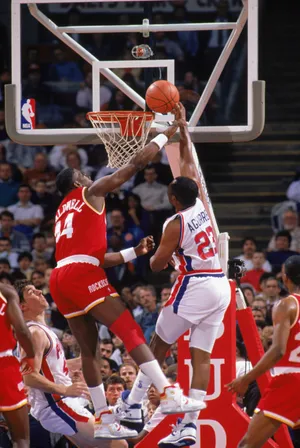 1989: Adrian Caldwell #23 of the Houston Rockets blocks the shot during a game in the1989-90 season. NOTE TO USER: User expressly acknowledges and agrees that, by downloading and/or using this Photograph, User is consenting to the terms and conditions of the Getty Images License Agreement. (Photo by: Getty Images/Getty Images)