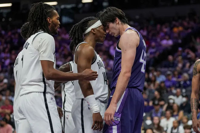 Mar 22, 2026; Sacramento, California, USA; Brooklyn Nets guard Terance Mann (14) and Sacramento Kings center Maxime Raynaud (42) get into an argument during the third quarter at Golden 1 Center. Mandatory Credit: Justine Willard-Imagn Images