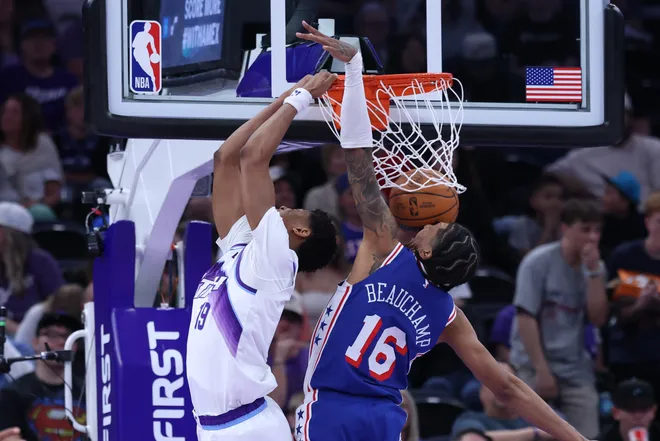 Mar 21, 2026; Salt Lake City, Utah, USA; Utah Jazz guard Ace Bailey (19) dunks the ball against Philadelphia 76ers forward Marjon Beauchamp (16) during the first half at Delta Center. Mandatory Credit: Rob Gray-Imagn Images