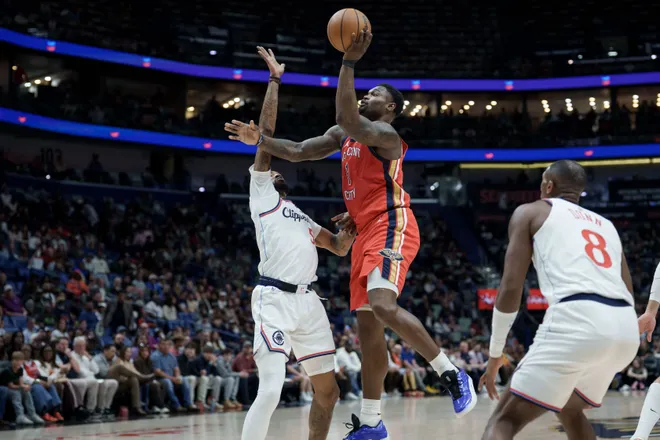 Mar 19, 2026; New Orleans, Louisiana, USA; New Orleans Pelicans forward Zion Williamson (1) shoots against LA Clippers forward Derrick Jones Jr. (5) during the first half at Smoothie King Center. Mandatory Credit: Matthew Hinton-Imagn Images