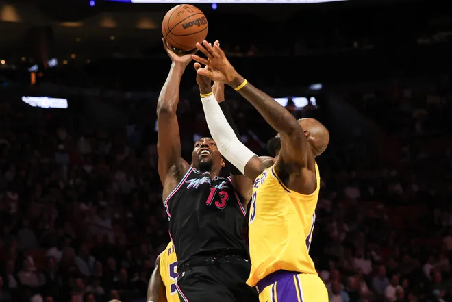 Mar 19, 2026; Miami, Florida, USA; Miami Heat center Bam Adebayo (13) shoots over Los Angeles Lakers forward LeBron James (23) during the second half at Kaseya Center. Mandatory Credit: Isabella Frias-Imagn Images
