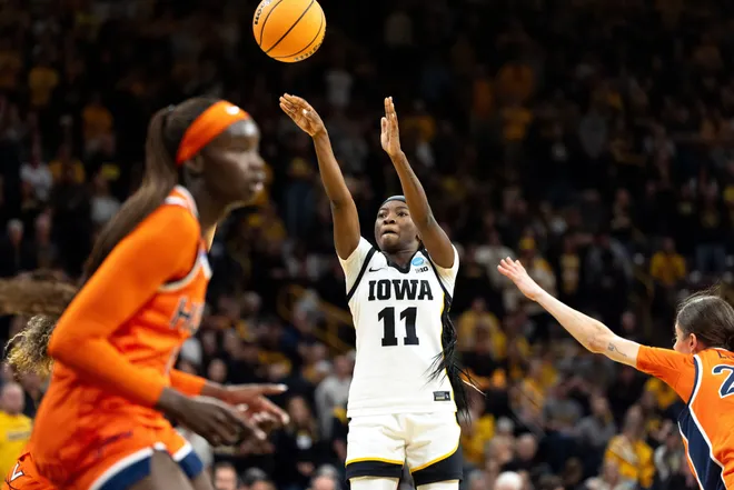 Iowa guard Chazadi Chit-Chat Wright (11) shoots the basketball against the Virginia Cavaliers on March 23, 2026, during a Round of 32 NCAA March Madness game at Carver-Hawkeye Arena in Iowa City, Iowa.