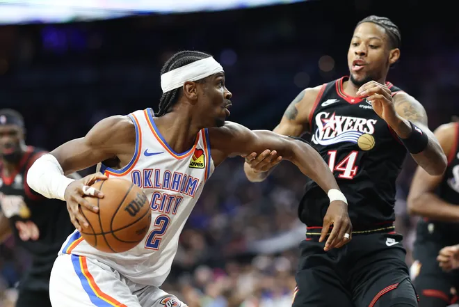 Mar 23, 2026; Philadelphia, Pennsylvania, USA; Oklahoma City Thunder guard Shai Gilgeous-Alexander (2) drives against Philadelphia 76ers forward Dalen Terry (14) during the third quarter at Xfinity Mobile Arena. Mandatory Credit: Bill Streicher-Imagn Images