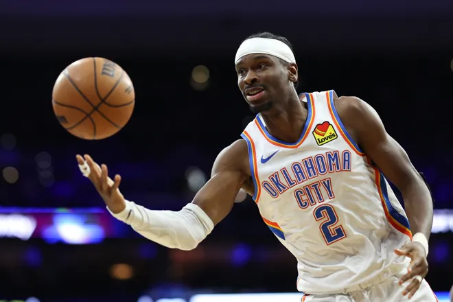 Mar 23, 2026; Philadelphia, Pennsylvania, USA; Oklahoma City Thunder guard Shai Gilgeous-Alexander (2) passes the ball against the Philadelphia 76ers during the third quarter at Xfinity Mobile Arena. Mandatory Credit: Bill Streicher-Imagn Images