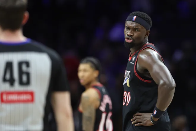 Mar 23, 2026; Philadelphia, Pennsylvania, USA; Philadelphia 76ers center Adem Bona (30) questions a call with referee Ben Taylor (46) during the second quarter against the Oklahoma City Thunder at Xfinity Mobile Arena. Mandatory Credit: Bill Streicher-Imagn Images