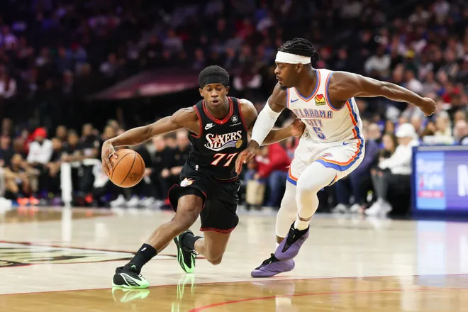 Mar 23, 2026; Philadelphia, Pennsylvania, USA; Philadelphia 76ers guard Vj Edgecombe (77) dribbles the ball against Oklahoma City Thunder guard Luguentz Dort (5) during the first quarter at Xfinity Mobile Arena. Mandatory Credit: Bill Streicher-Imagn Images