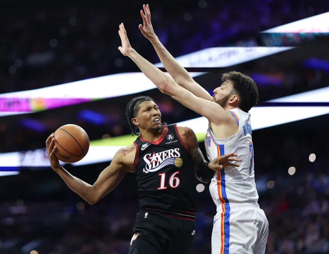 Mar 23, 2026; Philadelphia, Pennsylvania, USA; Philadelphia 76ers forward Marjon Beauchamp (16) drives against Oklahoma City Thunder center Chet Holmgren (7) during the first quarter at Xfinity Mobile Arena. Mandatory Credit: Bill Streicher-Imagn Images