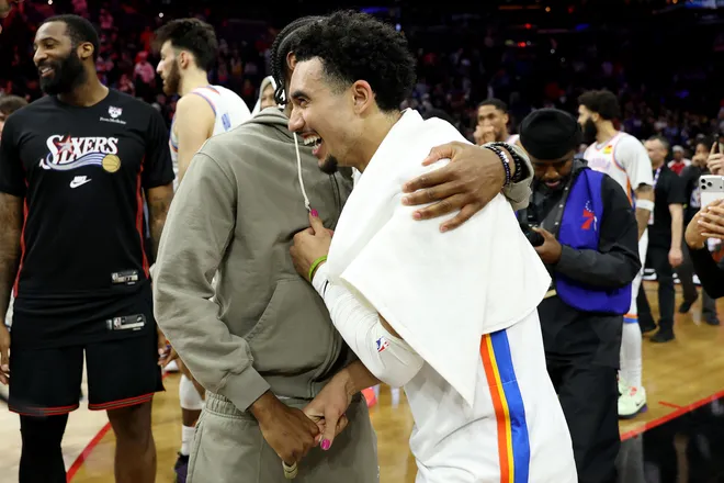PHILADELPHIA, PENNSYLVANIA - MARCH 23: Jared McCain #3 of the Oklahoma City Thunder hugs Tyrese Maxey #0 of the Philadelphia 76ers after a game at Xfinity Mobile Arena on March 23, 2026 in Philadelphia, Pennsylvania. NOTE TO USER: User expressly acknowledges and agrees that, by downloading and or using this photograph, User is consenting to the terms and conditions of the Getty Images License Agreement. (Photo by Emilee Chinn/Getty Images)