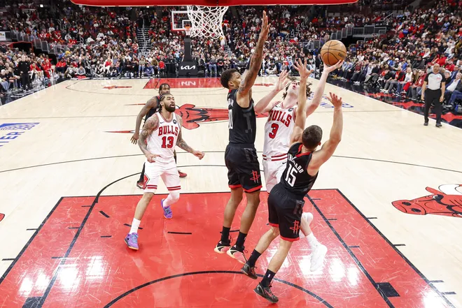 Mar 23, 2026; Chicago, Illinois, USA; Chicago Bulls guard Josh Giddey (3) shoots against the Houston Rockets during the first half at United Center. Mandatory Credit: Kamil Krzaczynski-Imagn Images