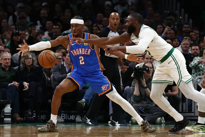 Mar 25, 2026; Boston, Massachusetts, USA; Oklahoma City Thunder guard Shai Gilgeous-Alexander (2) and Boston Celtics guard Jaylen Brown (7) eye a loose ball during the second quarter at TD Garden. Mandatory Credit: Winslow Townson-Imagn Images