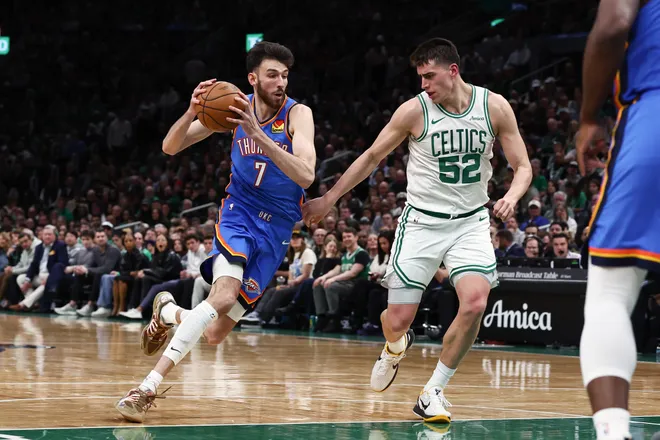 Mar 25, 2026; Boston, Massachusetts, USA; Oklahoma City Thunder center Chet Holmgren (7) drives on Boston Celtics center Luka Garza (52) during the second quarter at TD Garden. Mandatory Credit: Winslow Townson-Imagn Images