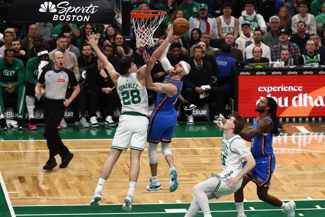 Mar 25, 2026; Boston, Massachusetts, USA; Oklahoma City Thunder guard Alex Caruso (9) shoots against Boston Celtics guard Hugo Gonzalez (28) during the first quarter at TD Garden. Mandatory Credit: Winslow Townson-Imagn Images