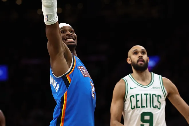 Mar 25, 2026; Boston, Massachusetts, USA; Oklahoma City Thunder guard Shai Gilgeous-Alexander (2) grimaces as he misses a foul shot as Boston Celtics guard Derrick White (9) looks on during the fourth quarter at TD Garden. Mandatory Credit: Winslow Townson-Imagn Images