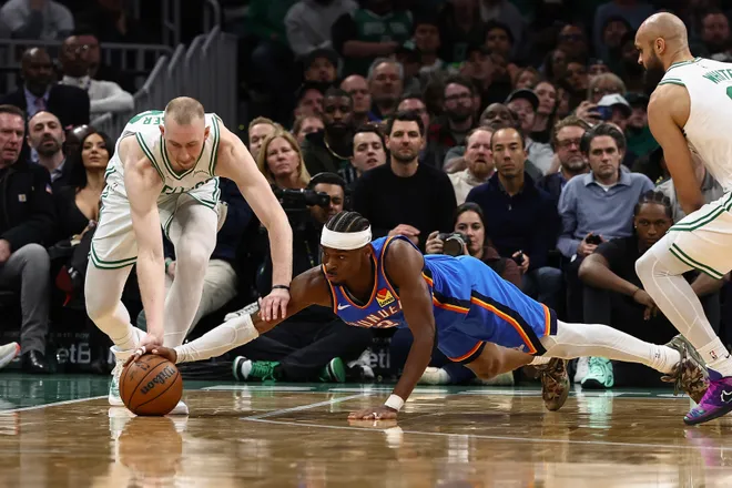 Mar 25, 2026; Boston, Massachusetts, USA; Oklahoma City Thunder guard Shai Gilgeous-Alexander (2) goes for a loose ball with Boston Celtics forward Sam Hauser (30) during the fourth quarter at TD Garden. Mandatory Credit: Winslow Townson-Imagn Images