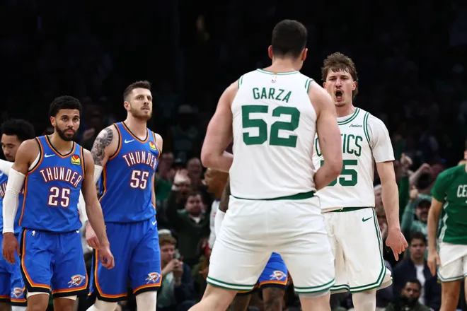 Mar 25, 2026; Boston, Massachusetts, USA; Boston Celtics guard Baylor Scheierman (55) celebrates with Boston Celtics center Luka Garza (52) as Oklahoma City Thunder guard Ajay Mitchell (25) and center Isaiah Hartenstein (55) head for the bench during the fourth quarter at TD Garden. Mandatory Credit: Winslow Townson-Imagn Images