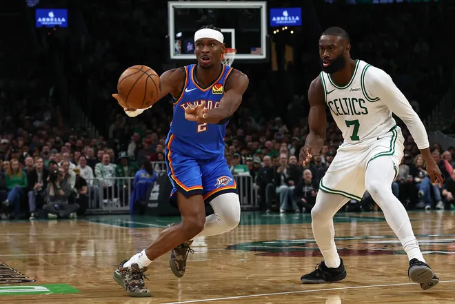 Mar 25, 2026; Boston, Massachusetts, USA; Oklahoma City Thunder guard Shai Gilgeous-Alexander (2) passes away from Boston Celtics guard Jaylen Brown (7) during the second quarter at TD Garden. Mandatory Credit: Winslow Townson-Imagn Images
