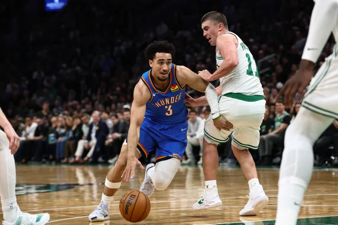 Mar 25, 2026; Boston, Massachusetts, USA; Oklahoma City Thunder guard Jared McCain (3) drives past Boston Celtics guard Payton Pritchard (11) during the second quarter at TD Garden. Mandatory Credit: Winslow Townson-Imagn Images
