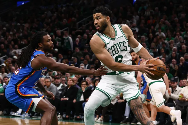 Mar 25, 2026; Boston, Massachusetts, USA; Boston Celtics forward Jayson Tatum (0) looks to get past Oklahoma City Thunder guard Cason Wallace (22) during the second quarter at TD Garden. Mandatory Credit: Winslow Townson-Imagn Images