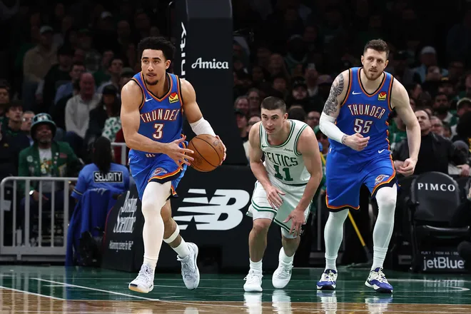 Mar 25, 2026; Boston, Massachusetts, USA; Oklahoma City Thunder guard Jared McCain (3) dribbles past Boston Celtics guard Payton Pritchard (11) during the second quarter at TD Garden. Mandatory Credit: Winslow Townson-Imagn Images