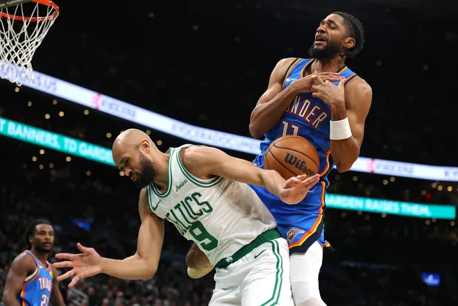 BOSTON, MASSACHUSETTS - MARCH 25: Isaiah Joe #11 of the Oklahoma City Thunder and Derrick White #9 of the Boston Celtics collide during the second half at TD Garden on March 25, 2026 in Boston, Massachusetts. The Celtics defeat the Thunder 119-109. NOTE TO USER: User expressly acknowledges and agrees that, by downloading and/or using this Photograph, user is consenting to the terms and conditions of the Getty Images License Agreement. (Photo by Maddie Meyer/Getty Images)