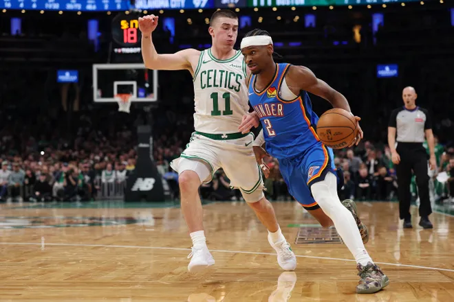 BOSTON, MASSACHUSETTS - MARCH 25: Shai Gilgeous-Alexander #2 of the Oklahoma City Thunder drives to the basket against Payton Pritchard #11 of the Boston Celtics during the second half at TD Garden on March 25, 2026 in Boston, Massachusetts. The Celtics defeat the Thunder 119-109. NOTE TO USER: User expressly acknowledges and agrees that, by downloading and/or using this Photograph, user is consenting to the terms and conditions of the Getty Images License Agreement. (Photo by Maddie Meyer/Getty Images)