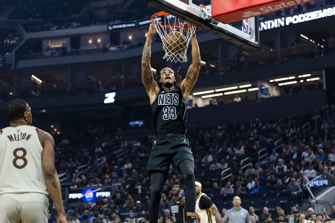 Mar 25, 2026; San Francisco, California, USA; Brooklyn Nets center Nic Claxton (33) dunks the ball against the Golden State Warriors during the first quarter at Chase Center.
