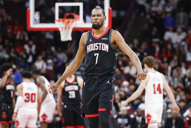 Mar 23, 2026; Chicago, Illinois, USA; Houston Rockets forward Kevin Durant (7) reacts to a basket scored by center Alperen Sengun (28) against the Chicago Bulls during the second half at United Center.
