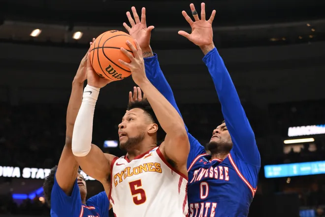 Mar 20, 2026; St. Louis, MO, USA; Iowa State Cyclones forward Joshua Jefferson (5) shoots a layup against Tennessee State Tigers forwards Antoine Lorick III (11) and Jalen Pitre (0) during the first half of a first round game of the men's 2026 NCAA Tournament at Enterprise Center. Mandatory Credit: Jeff Curry-Imagn Images